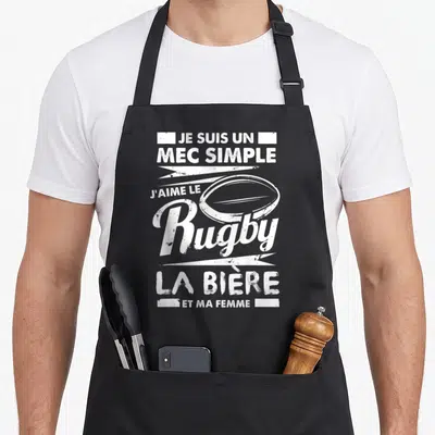 Tablier de cuisine noir avec inscription blanche Je suis un mec simple j'aime le rugby la bière et ma femme et un ballon ovale.