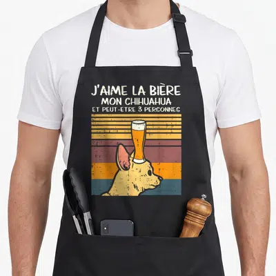 Tablier de cuisine noir avec illustration d'un chihuahua portant un verre de bière sur la tête et texte humoristique.