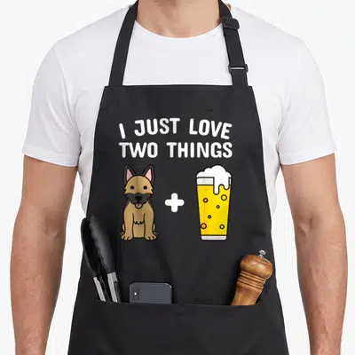 Tablier de cuisine noir avec illustration d'un chien assis, une croix blanche et une coupe de bière jaune à la mousse blanche.
