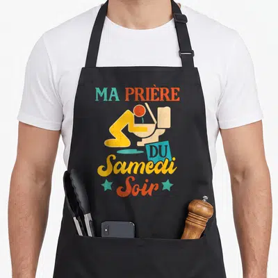 Tablier de cuisine noir avec illustration vintage Ma Prière Du Samedi Soir et silhouette sur toilette.