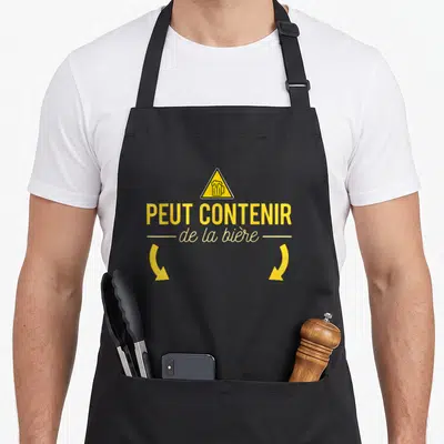 Tablier de cuisine noir avec un triangle jaune signalant qu'il peut contenir de la bière.