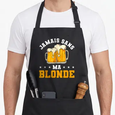 Tablier de cuisine noir avec deux verres de bière blonde s'entrechoquant et le texte Jamais sans ma blonde en blanc et orange.