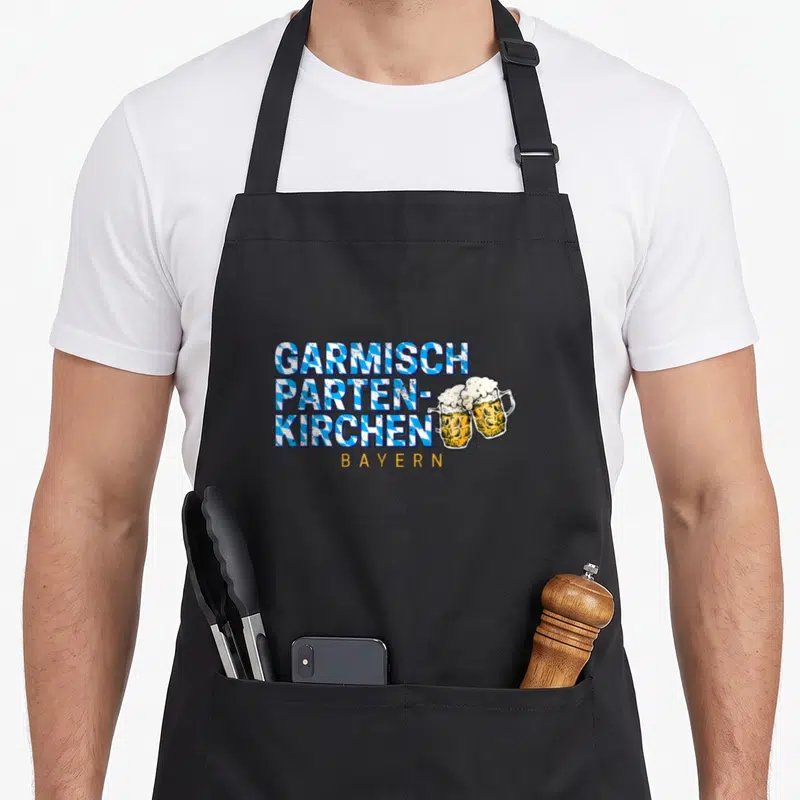 Tablier de cuisine noir avec inscription Garmisch Partenkirchen Bayern et deux verres de bière à la mousse.