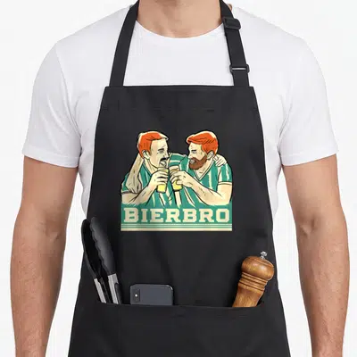 Tablier de cuisine noir avec illustration de deux hommes aux cheveux roux trinquant et du texte BIERBRO en bas.