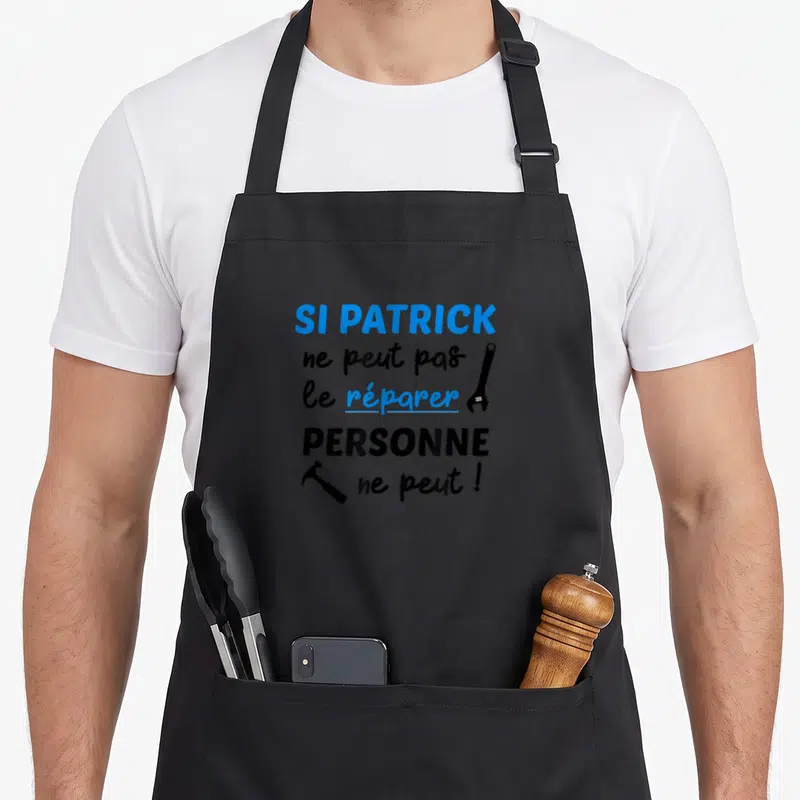 Tablier de cuisine noir avec inscription Si Patrick ne peut pas le réparer personne ne peut et outils dessinés.
