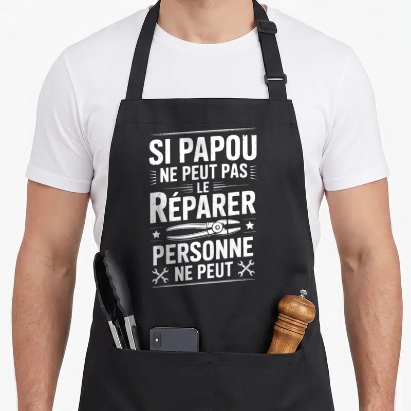 Tablier de cuisine noir avec inscription blanche Si Papou ne peut pas le réparer personne ne peut et une illustration de pince.