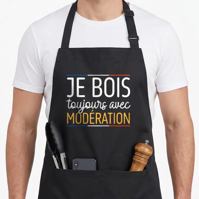 Tablier de cuisine noir avec l'inscription Je bois toujours avec modération en blanc et orange.