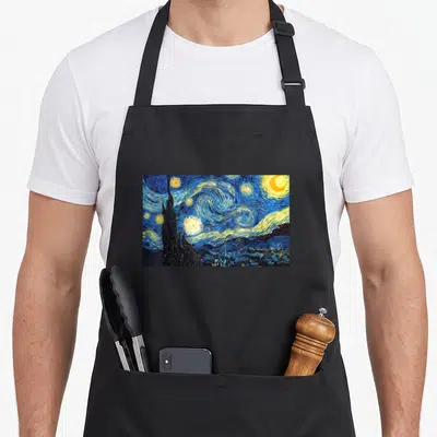 Tablier de cuisine noir avec reproduction de La Nuit étoilée de Van Gogh imprimée au centre.