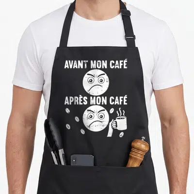 Tablier de cuisine noir avec deux visages blancs expressifs et le texte Avant Mon Café Après Mon Café.