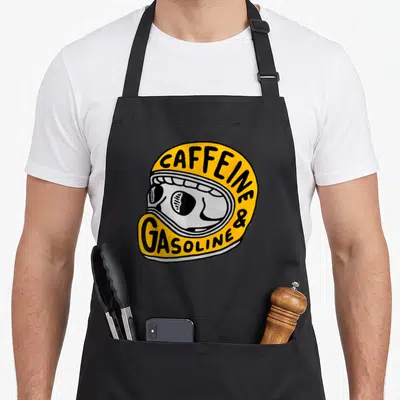 Tablier de cuisine noir avec illustration casque de moto jaune et crâne stylisé