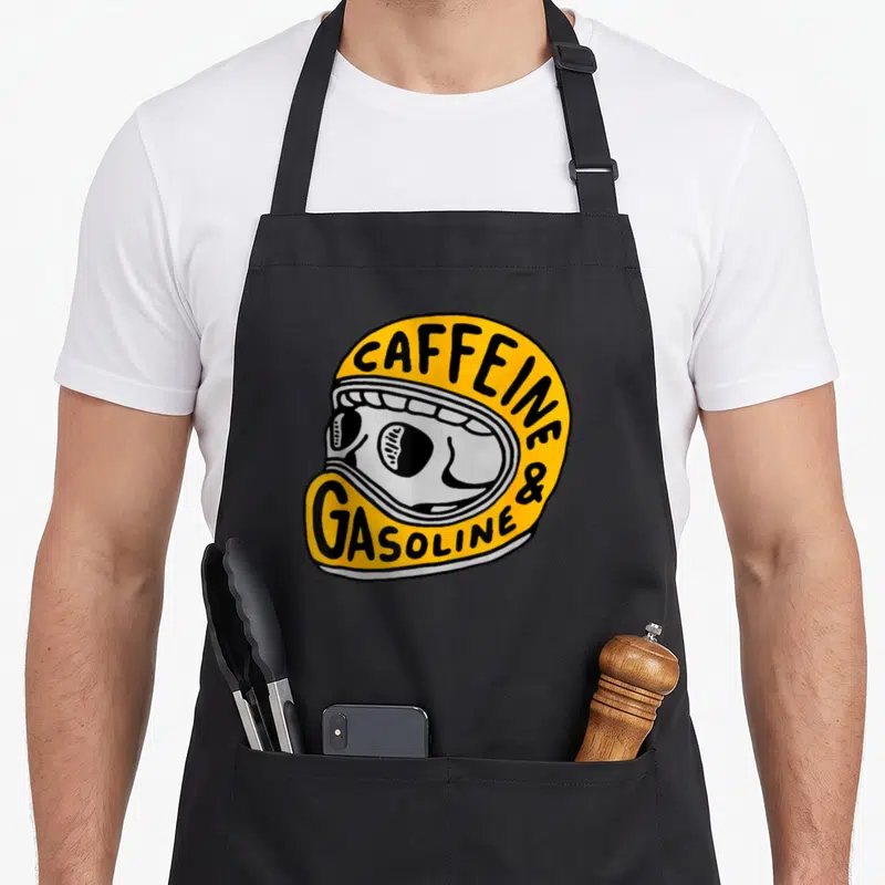 Tablier de cuisine noir avec illustration casque de moto jaune et crâne stylisé