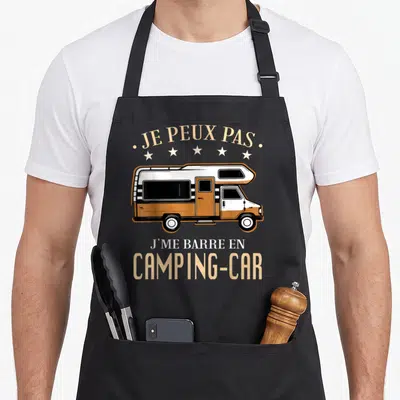 Tablier de cuisine noir avec illustration d'un camping-car orange et blanc et le texte Je peux pas j me barre en camping car.