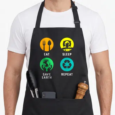 Tablier de cuisine noir avec quatre icônes colorées Eat Sleep Save Earth Repeat.