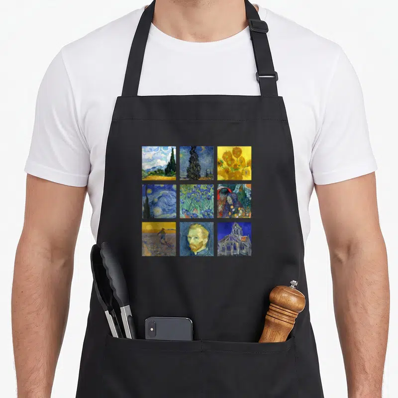 Tablier de cuisine noir avec une grille de neuf reproductions artistiques représentant les œuvres de Vincent van Gogh.