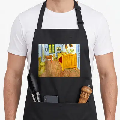 Tablier de cuisine noir avec reproduction de la chambre de Van Gogh à Arles en couleurs vives et style post-impressionniste.