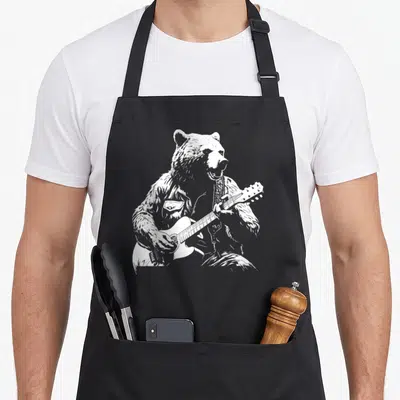 Tablier de cuisine noir avec illustration blanche d'un ours jouant de la guitare acoustique.