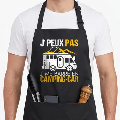Tablier de cuisine noir avec une illustration de camping-car et le texte J'peux pas j'me barre en camping-car