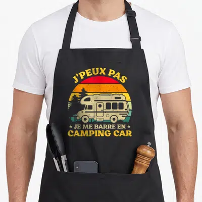 Tablier de cuisine noir avec illustration vintage d'un camping-car et texte jaune J'peux pas je me barre en camping car.