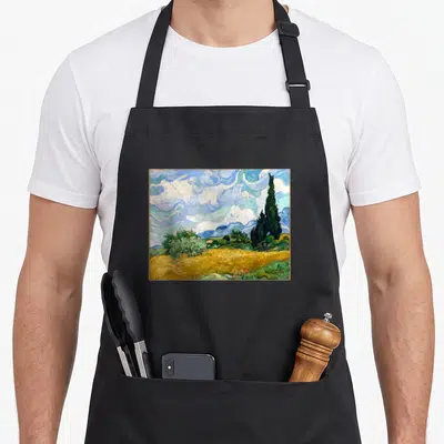Tablier de cuisine noir avec une reproduction du tableau Wheat Field with Cypresses de Van Gogh.