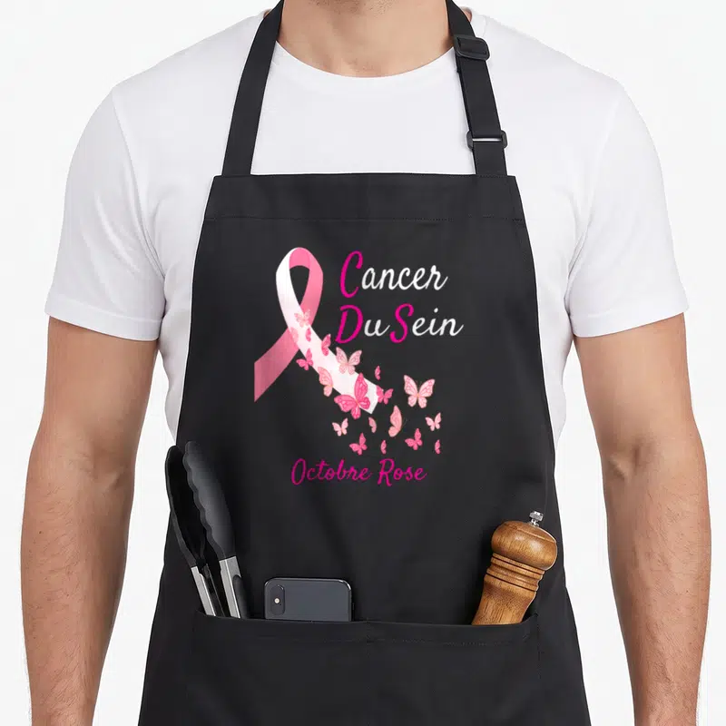 Tablier de cuisine noir avec un ruban rose, des papillons et les mots Cancer Du Sein Octobre Rose