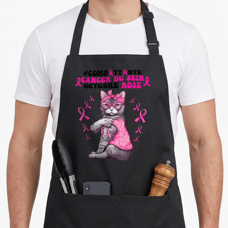 Tablier de cuisine noir avec un chat gris portant des lunettes roses et des rubans de sensibilisation.