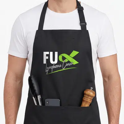 Tablier de cuisine noir avec l'inscription FUX Lymphoma Cancer et un ruban vert citron stylisé.