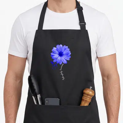 Tablier de cuisine noir avec une fleur bleue stylisée, des petits rubans et le texte Hydrocephaly Awareness écrit en blanc.