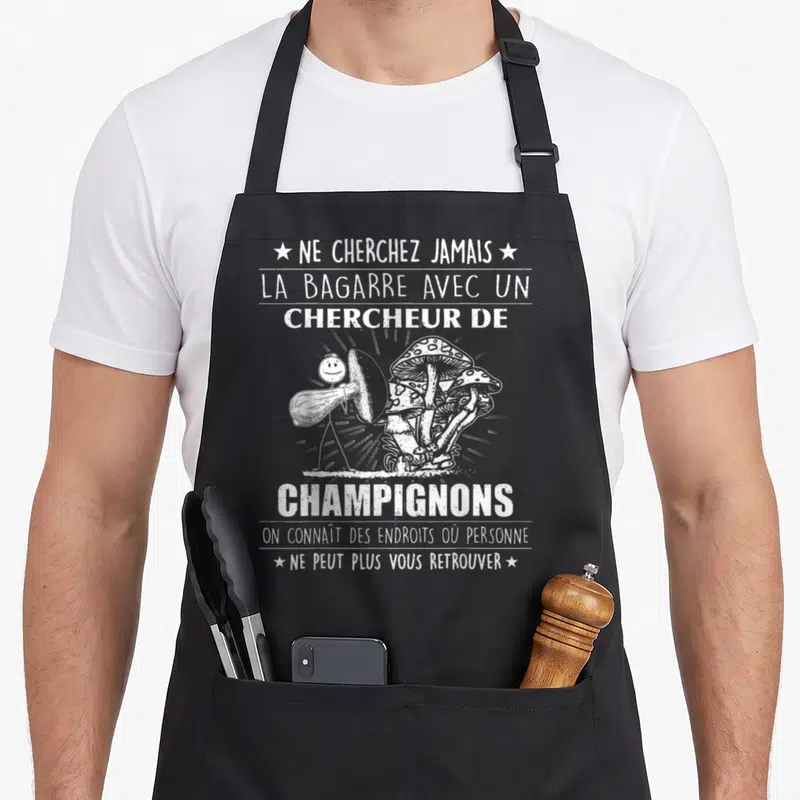 Tablier de cuisine noir avec texte blanc Ne cherchez jamais la bagarre avec un chercheur de champignons et illustration de mushroom.