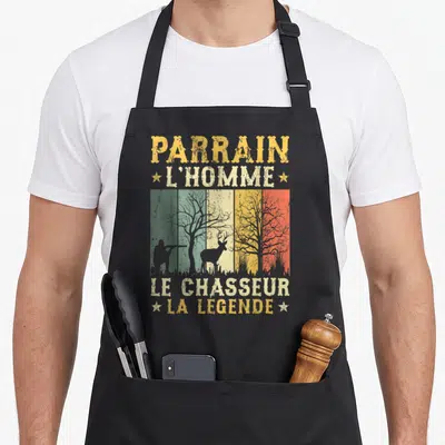Tablier de cuisine noir avec illustration vintage d'un chasseur et d'un cerf sur bandes colorées.