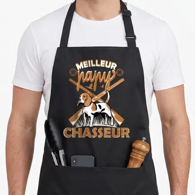 Tablier de cuisine noir avec illustration chien de chasse fusils croisés et texte Meilleur papy Chasseur en orange.