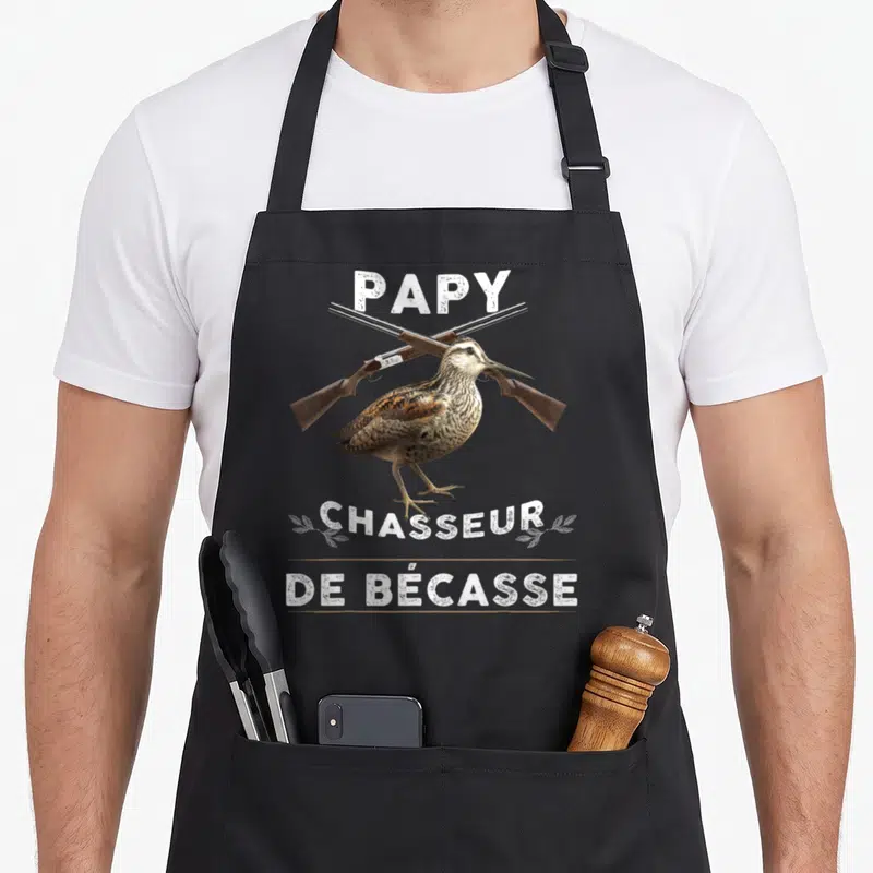 Tablier de cuisine noir avec illustration d'une bécasse et deux fusils croisés sous le mot papy.
