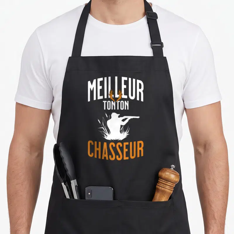 Tablier de cuisine noir avec inscription Meilleur tonton chasseur et silhouette blanche tenant un fusil dans les roseaux.