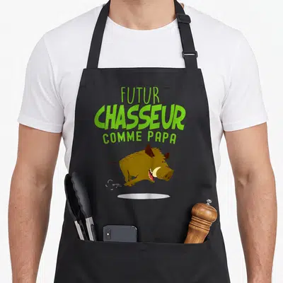 Tablier de cuisine noir avec illustration de sanglier marron et texte vert Futur Chasseur Comme Papa