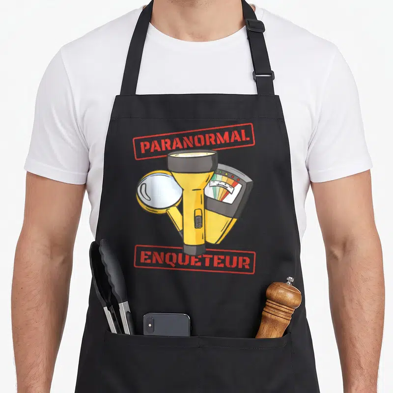 Tablier de cuisine noir avec illustration détecteur EMF lampe de poche loupe et texte Paranormal Enquêteur en rouge.