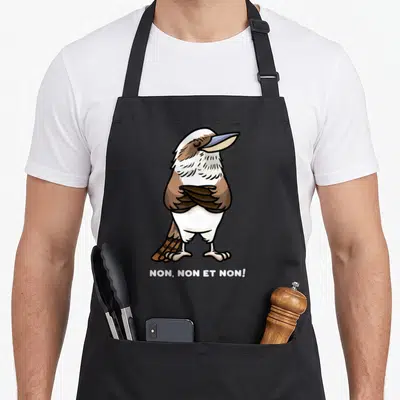 Tablier de cuisine noir avec illustration d'un oiseau kookaburra aux ailes croisées et le texte NON, NON ET NON.