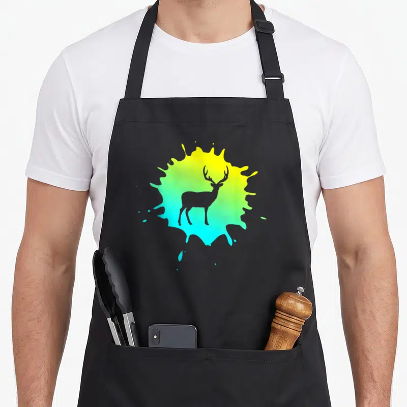 Tablier de cuisine noir avec silhouette de cerf sur éclaboussure dégradée jaune vert et cyan