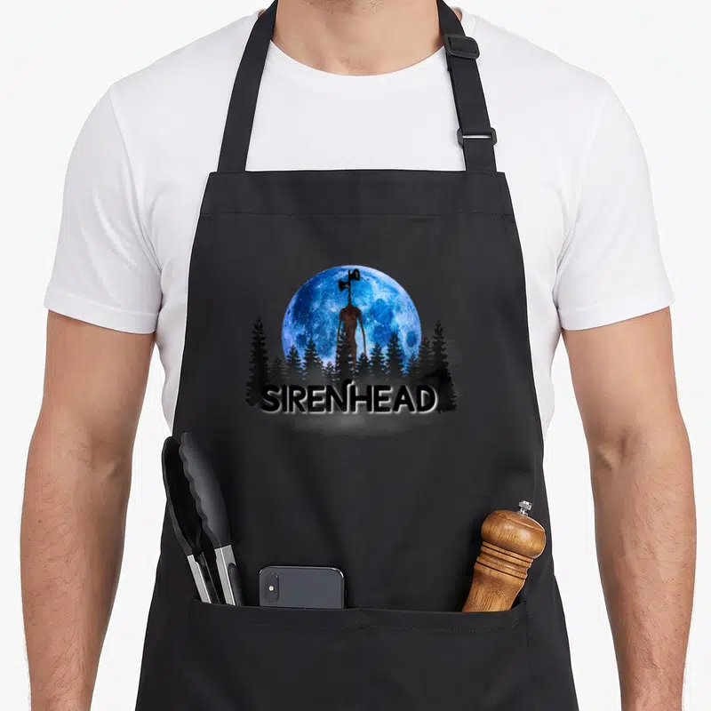Tablier de cuisine noir avec silhouette Sirenhead devant une lune bleue et des arbres sombres, texte SIRENHEAD en bas.