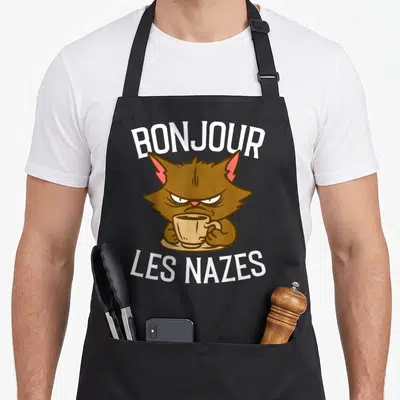 Tablier de cuisine noir avec un chaton brun boudeur tenant une tasse de café et le texte Bonjour les nazes.