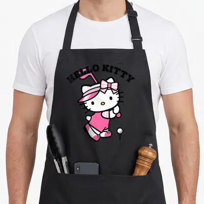 Tablier de cuisine noir avec Hello Kitty en tenue de golfeuse rose et sa casquette assortie.