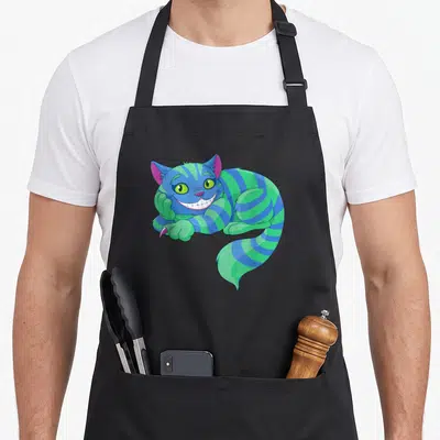 Tablier de cuisine noir avec un chat rayé vert et bleu affichant un large sourire.