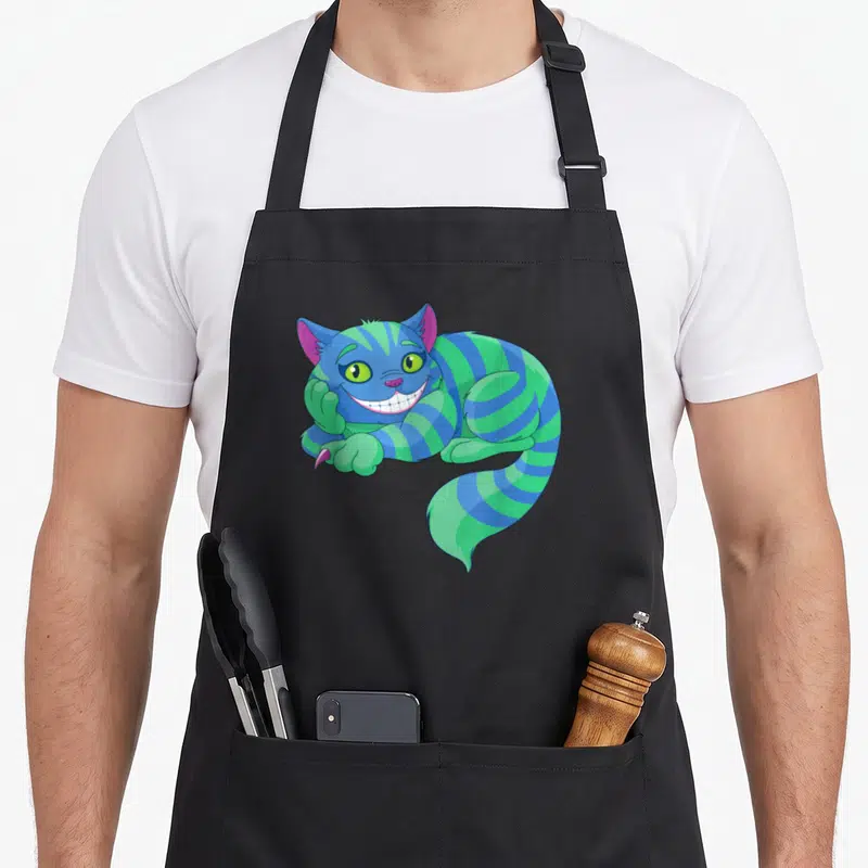 Tablier de cuisine noir avec un chat rayé vert et bleu affichant un large sourire.