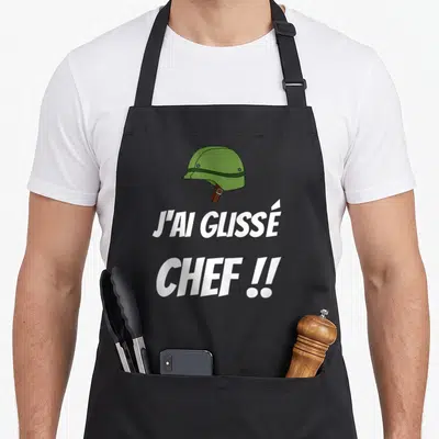 Tablier de cuisine noir avec illustration de casque vert et texte blanc J'ai glissé chef