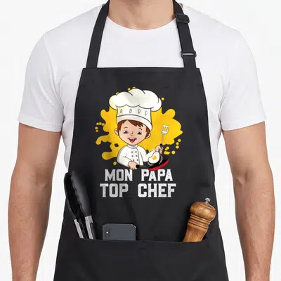 Tablier de cuisine noir avec illustration d'un enfant cuisinier et texte Mon Papa Top Chef