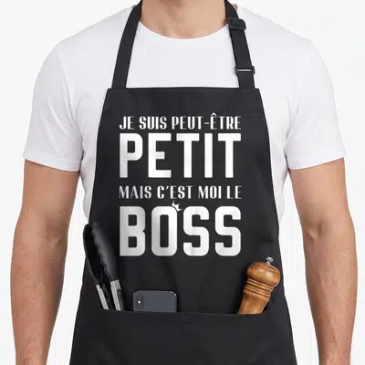 Tablier de cuisine noir avec inscription blanche Je suis petit mais c'est moi le boss et une petite couronne au-dessus du O.