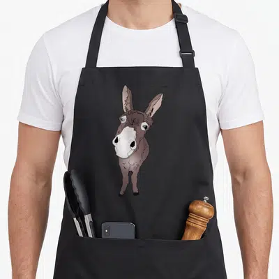 Tablier de cuisine noir avec illustration d'un âne marron aux grands yeux blancs et museau clair.