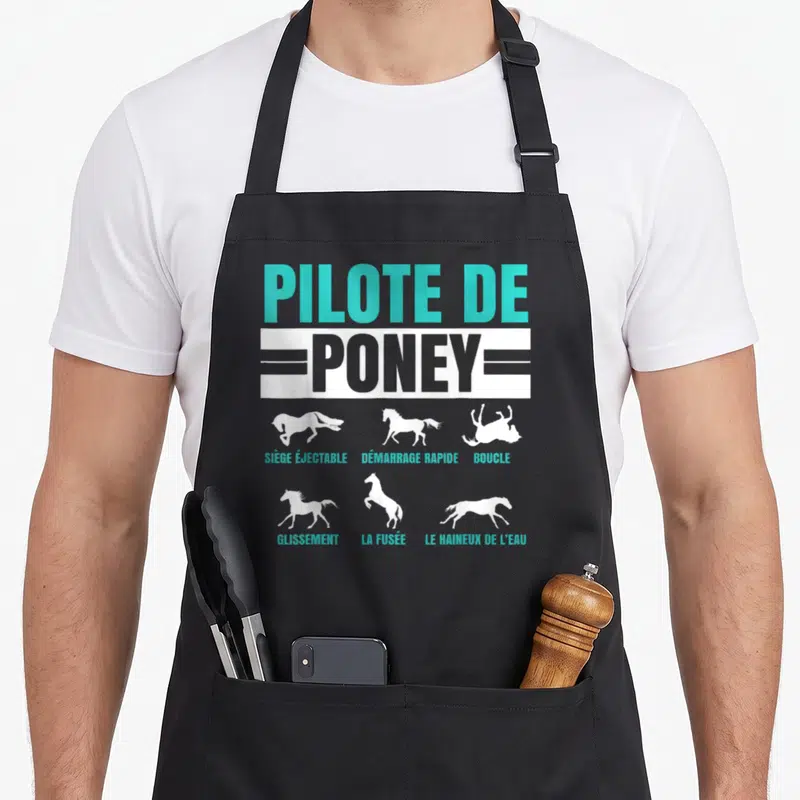 Tablier de cuisine noir avec inscription Pilote de Poney et silhouettes de poneys en mouvement blanc et turquoise.