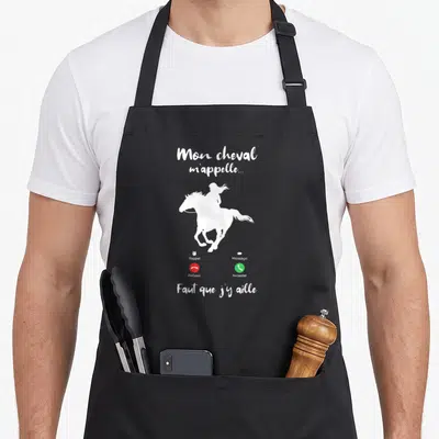 Tablier de cuisine noir avec silhouette blanche d'un cavalier au galop et boutons d'appel téléphonique rouge et vert.
