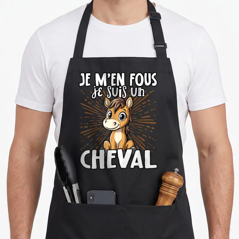 Tablier de cuisine noir avec un dessin de poulain et le texte Je m'en fous je suis un cheval