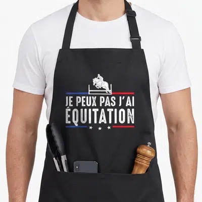 Tablier de cuisine noir avec silhouette cavalier et texte Je peux pas j'ai équitation en blanc.