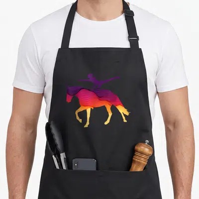 Tablier de cuisine noir avec une illustration colorée d'une cavalière effectuant une voltige sur un cheval au galop stylisé.